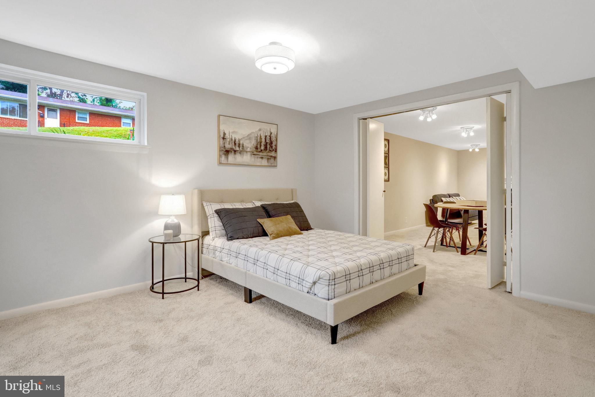 4206 16th Road South Arlington, VA 22204 - Photo 27 of 35 a spacious bedroom with a bed and a cabinets