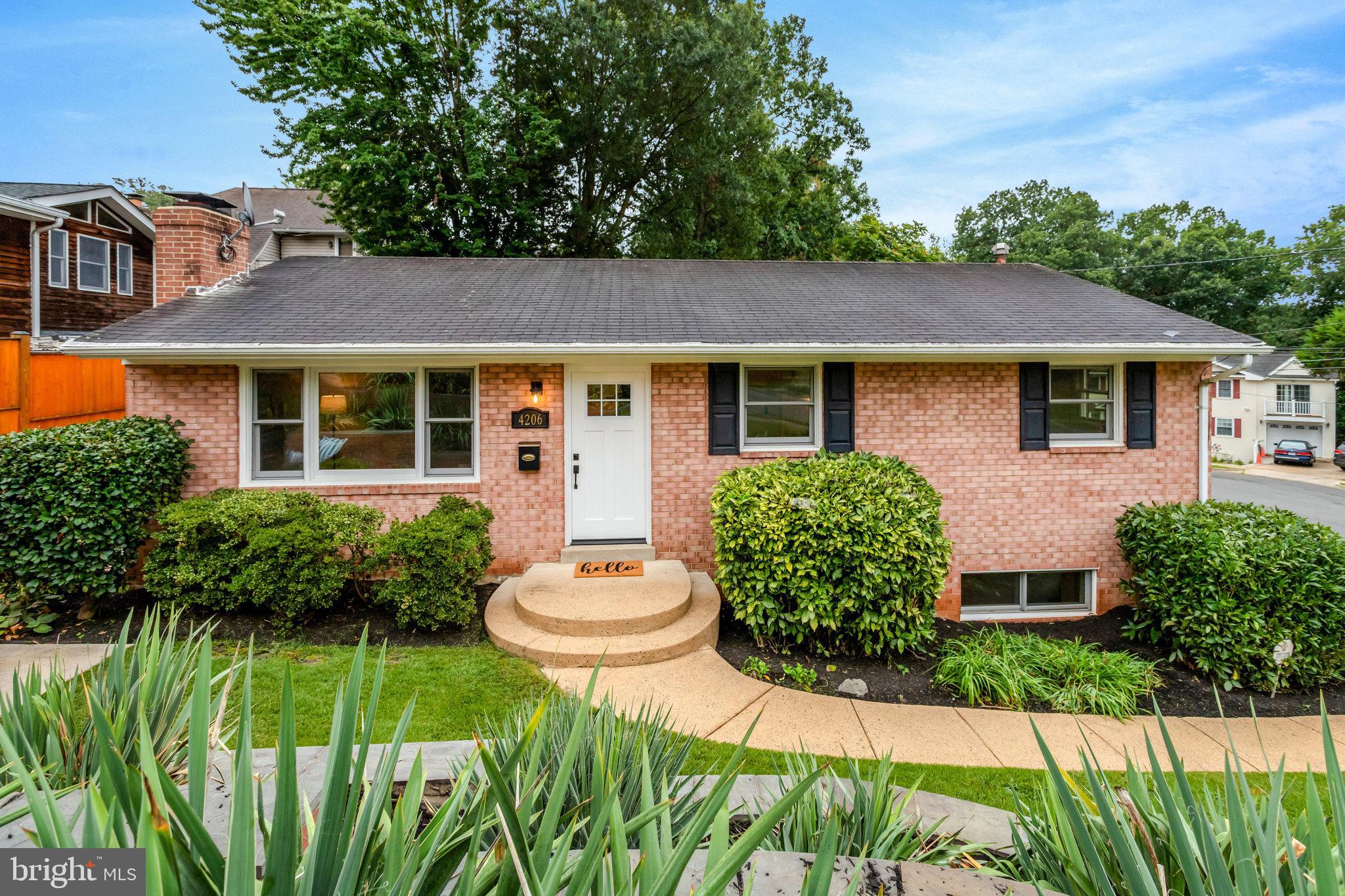 4206 16th Road South Arlington, VA 22204 - Photo 3 of 35 a view of a house with a yard and potted plants
