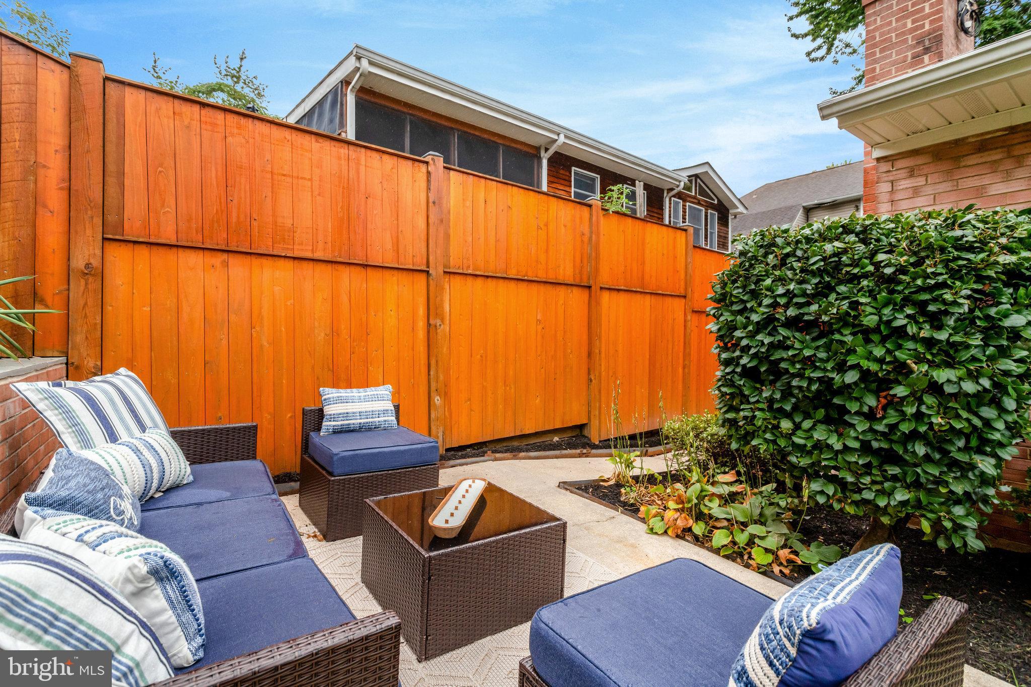 4206 16th Road South Arlington, VA 22204 - Photo 34 of 35 a backyard of a house with sofas table and chairs