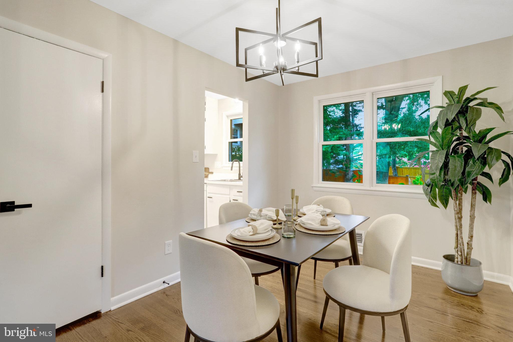 4206 16th Road South Arlington, VA 22204 - Photo 7 of 35 a view of a dining room with furniture window and wooden floor