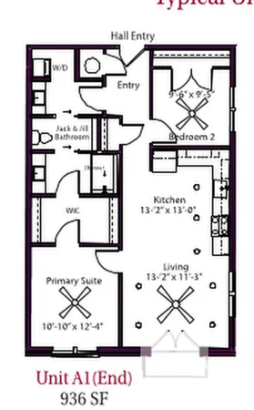 a front view of a building with a garden and plants