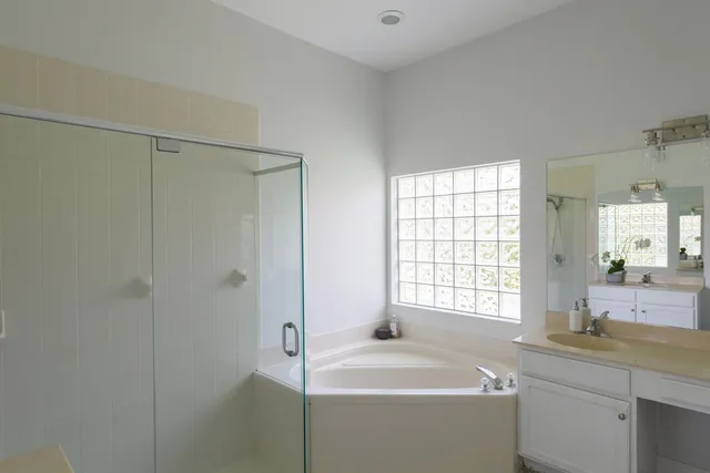 a bathroom with a sink a toilet and a tub