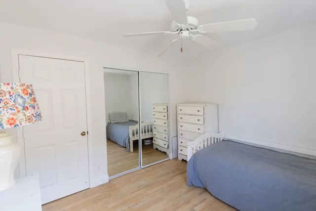 a spacious bedroom with a bed and a table