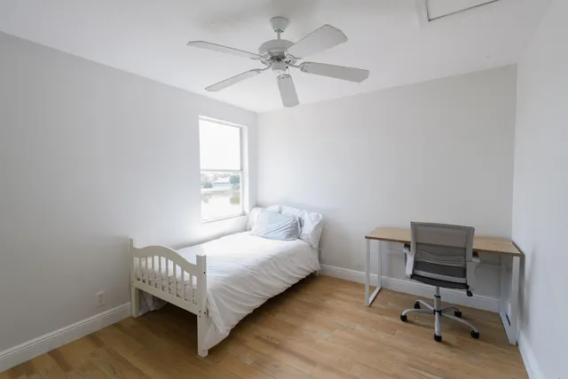 a bed room with a bed and a window