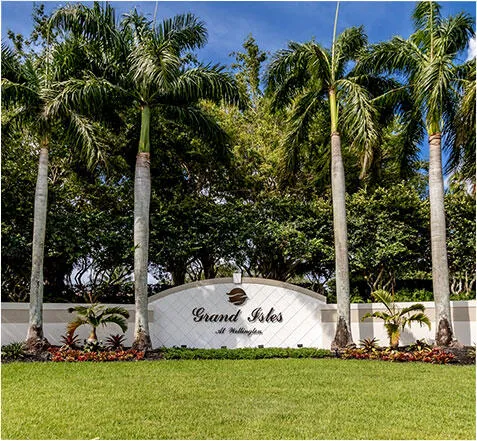 a view of a white house with a yard and sitting area