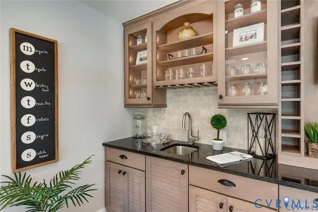 a kitchen with a sink and a stove