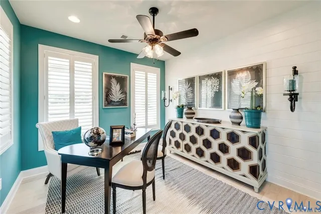 a dining room with furniture and window