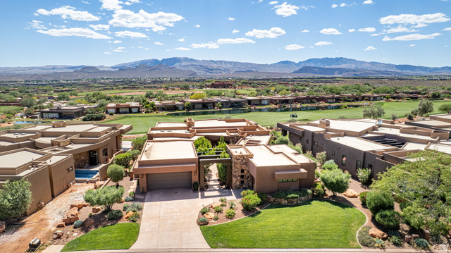 2331 West Entrada Trail, Unit 61 St. George, UT 84770 - Photo 62 of 69 Contemporary flat-roof residence featuring an integrated garage, stone accents, and desert landscaping