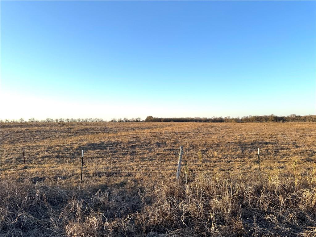 10-ac Cr 151 Road Riesel, TX 76682 - Photo 7 of 9 a view of a lake next to a large building
