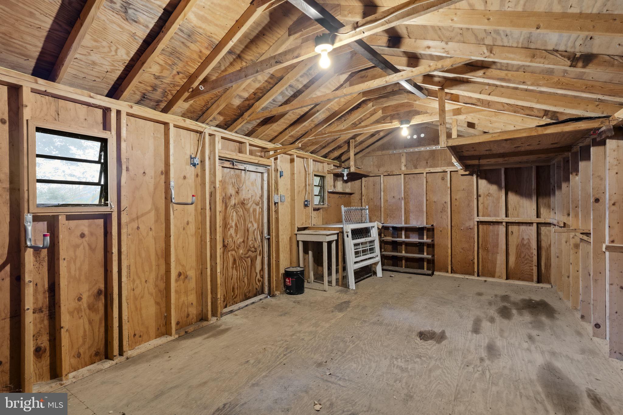65 Compass Road Parkesburg, PA 19365 - Photo 56 of 61 Spacious wooden workshop awaits creativity.