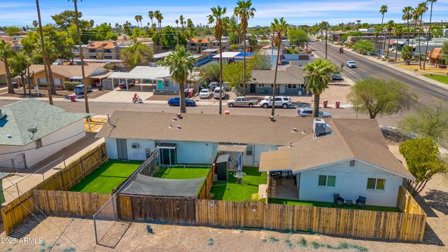 a view of multiple houses with yard