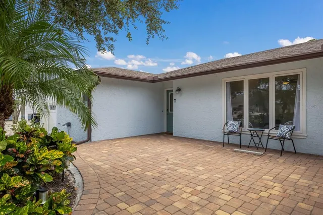 a kitchen that has a table and chairs in it