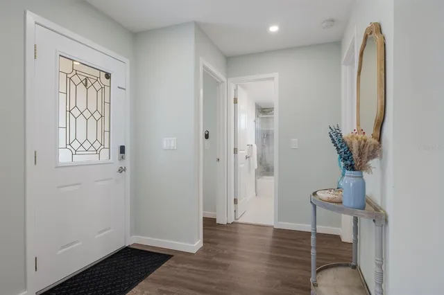 a view of a dining room with furniture wooden floor and a window
