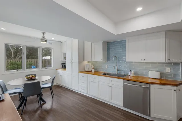a living room with furniture a air conditioner and a window