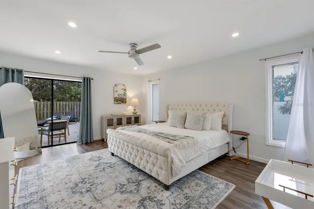 an aerial view of a house with a garden and lake view