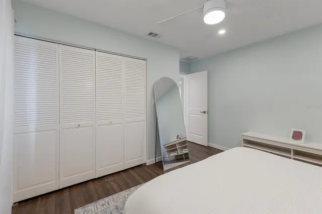 a view of a street with some trees on both side of it