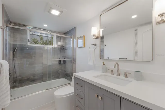 an aerial view of a city with ocean view