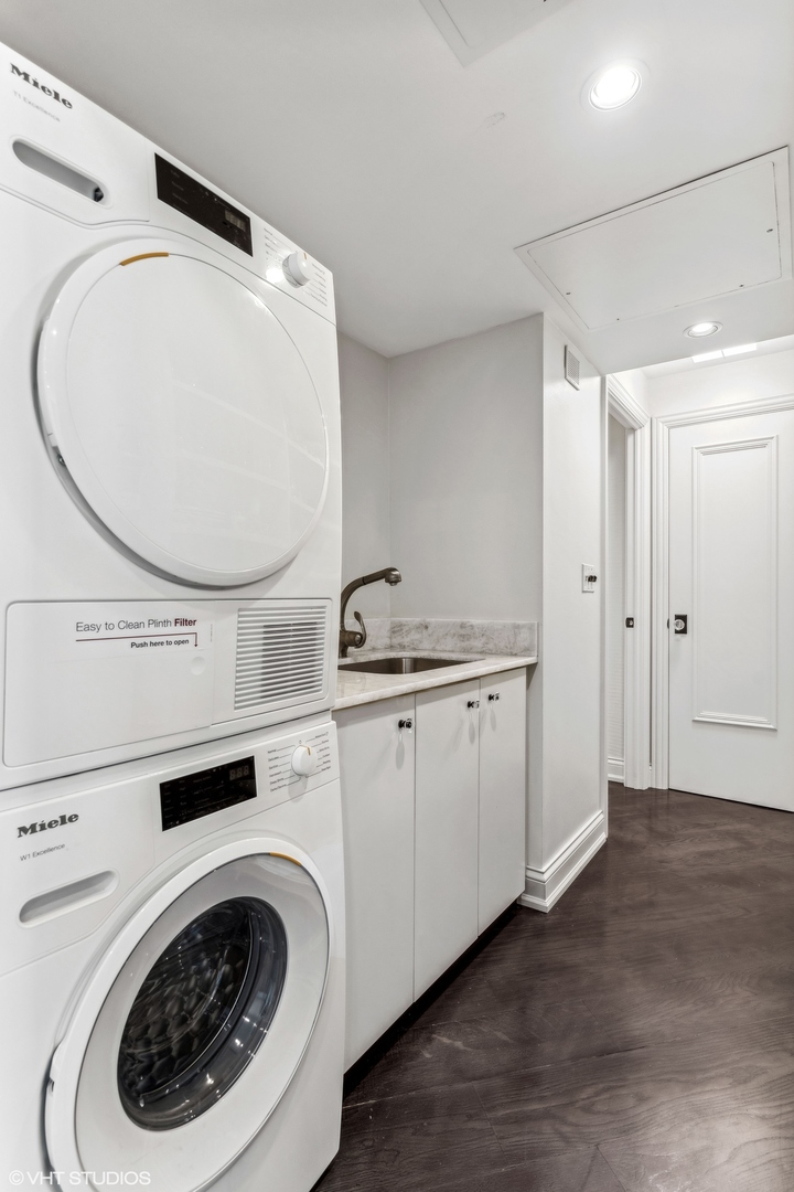 1040 North Lake Shore Drive, Unit 26B Chicago, IL 60611 - Photo 11 of 22 a utility room with dryer and washer