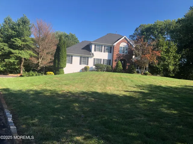 a bed sitting in a room next to a window