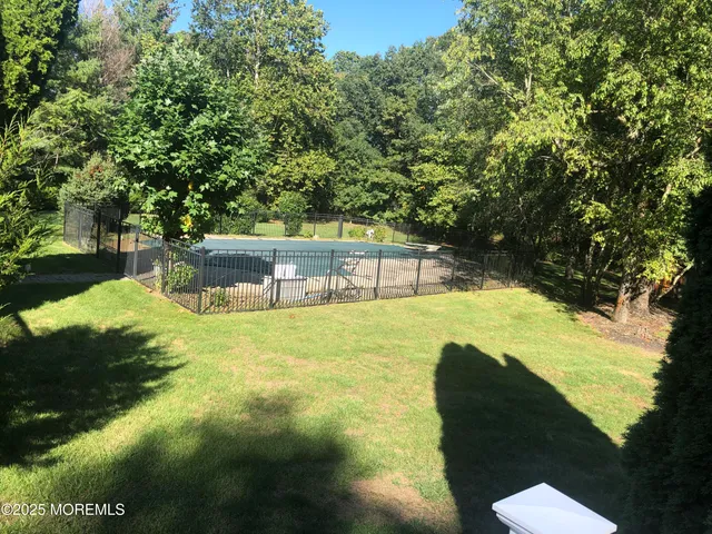 a living room with furniture a rug and a window