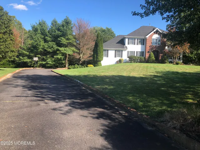 a view of a swimming pool and outdoor seating