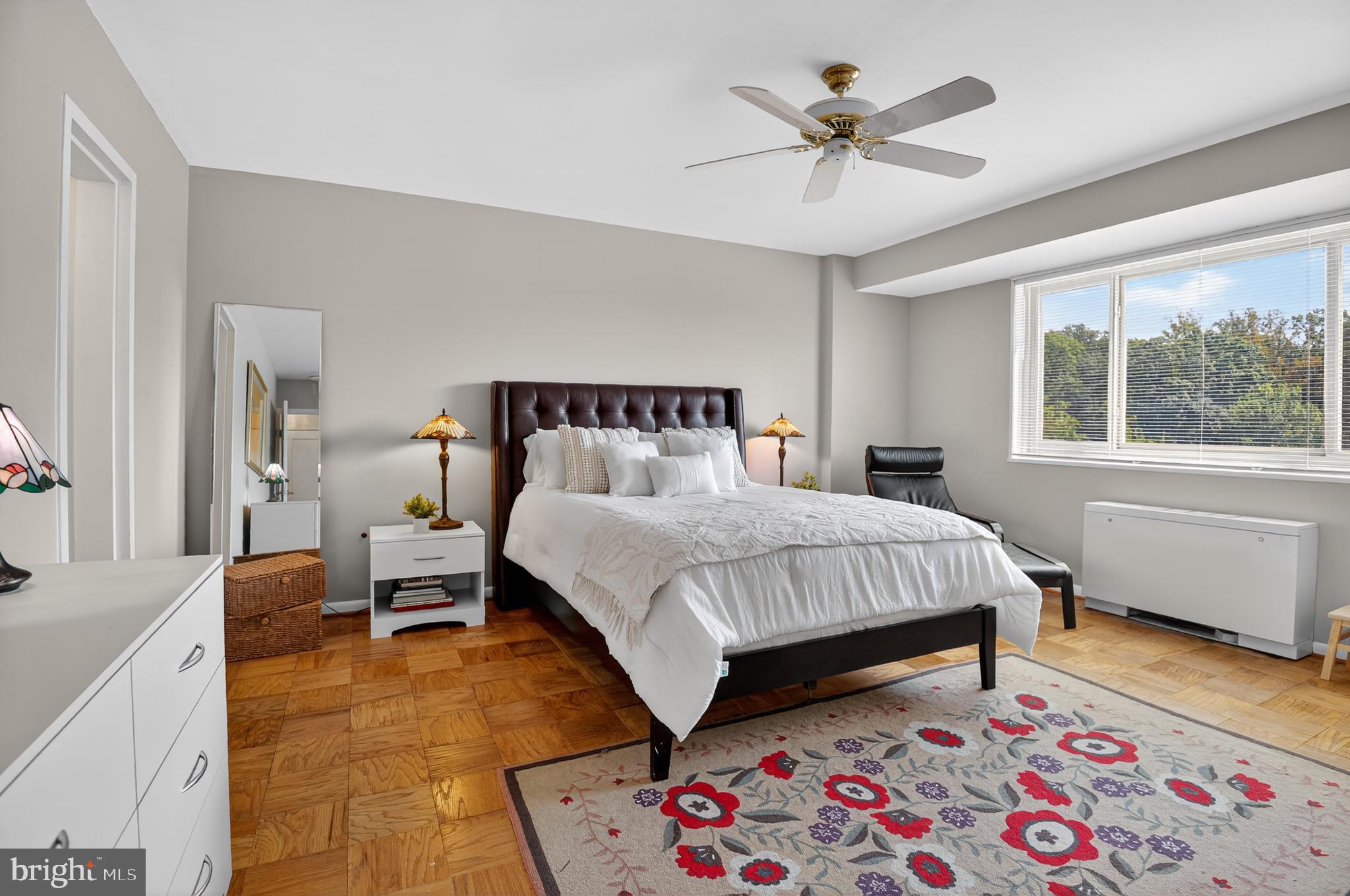 5100 Dorset Avenue, Unit 314 Chevy Chase, MD 20815 - Photo 19 of 30 a bed room with a bed and a chandelier
