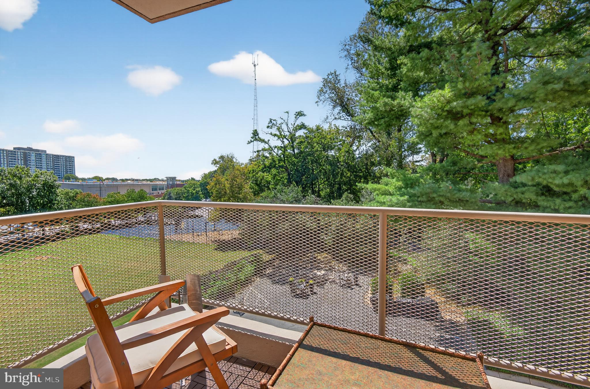5100 Dorset Avenue, Unit 314 Chevy Chase, MD 20815 - Photo 22 of 30 a view of a lake with a deck