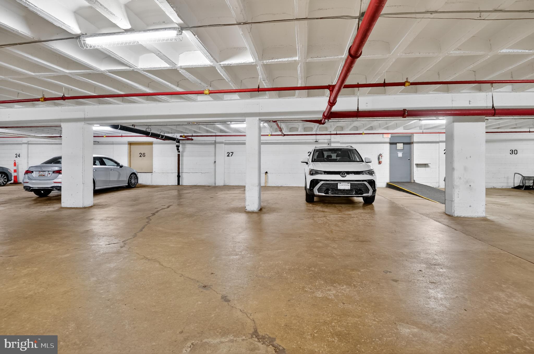 5100 Dorset Avenue, Unit 314 Chevy Chase, MD 20815 - Photo 25 of 30 a car parked in a parking garage