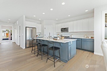 33632 Northeast 42nd Street Carnation, WA 98014 - Photo 13 of 28 a kitchen with a sink a counter top space and stainless steel appliances