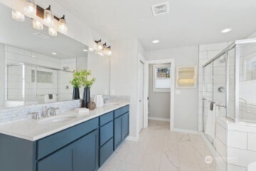 33632 Northeast 42nd Street Carnation, WA 98014 - Photo 22 of 28 a bathroom with a double vanity sink mirror and shower