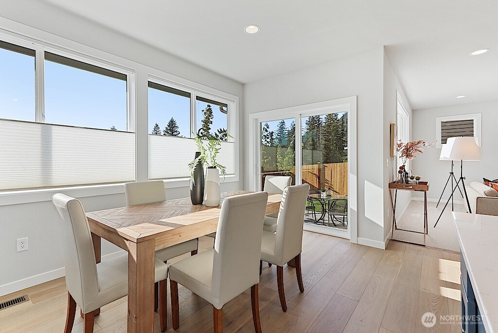 33632 Northeast 42nd Street Carnation, WA 98014 - Photo 8 of 28 a view of a dining room with furniture window and wooden floor