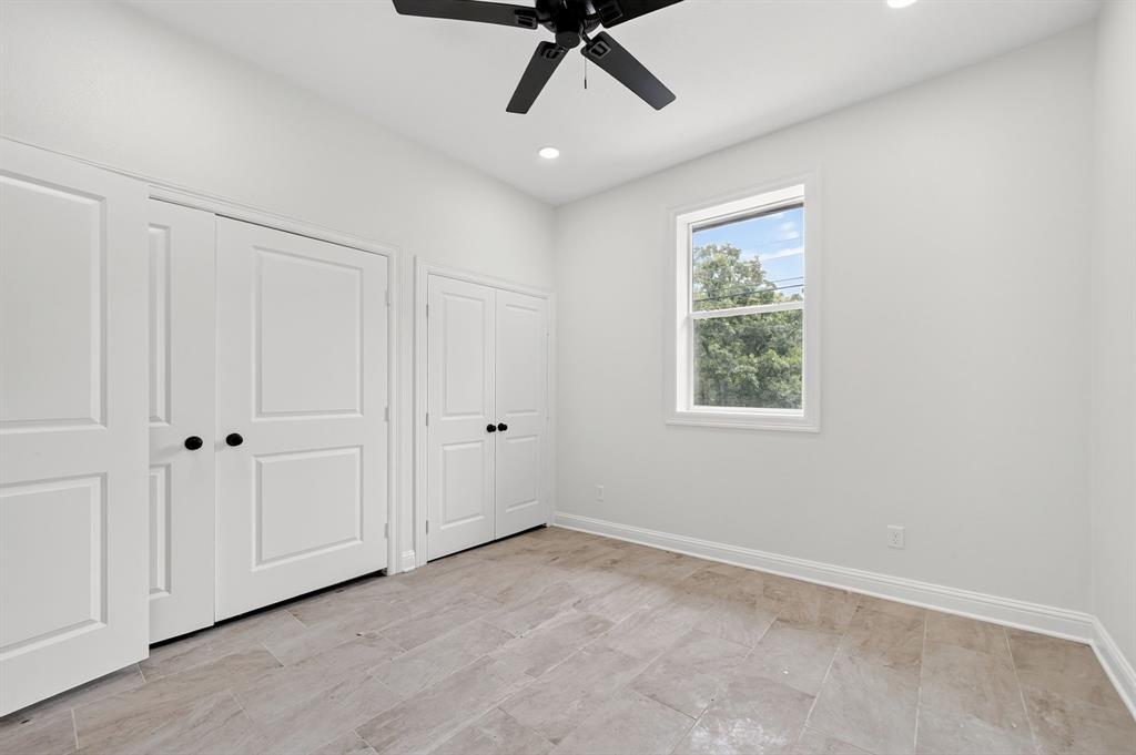 608 Bunny Rabbit Road Athens, TX 75751 - Photo 19 of 33 Bright interior space featuring light-toned flooring, white walls, and a ceiling fan