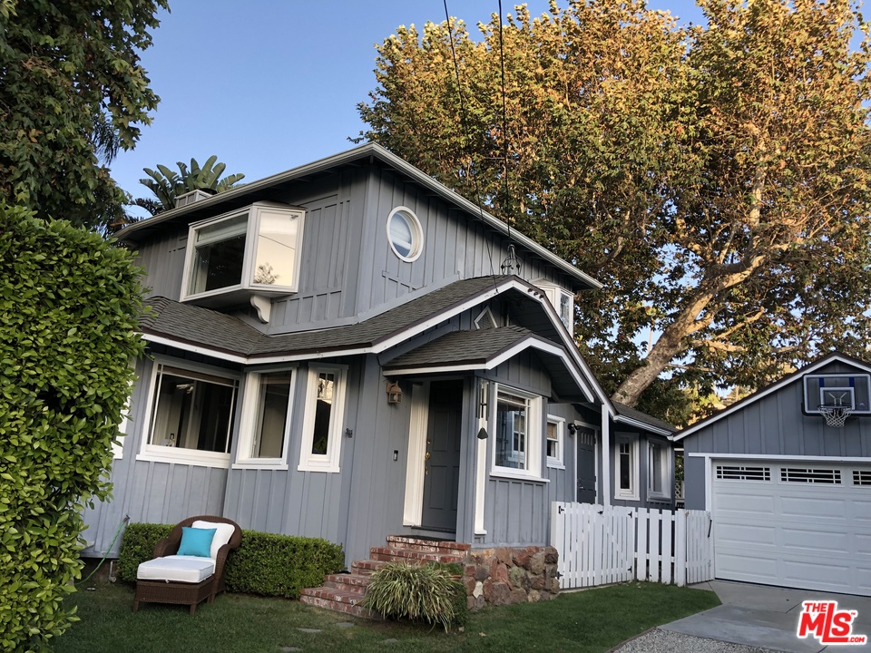 216 West Channel Road Santa Monica, CA 90402 - Photo 1 of 37 a front view of a house with garden
