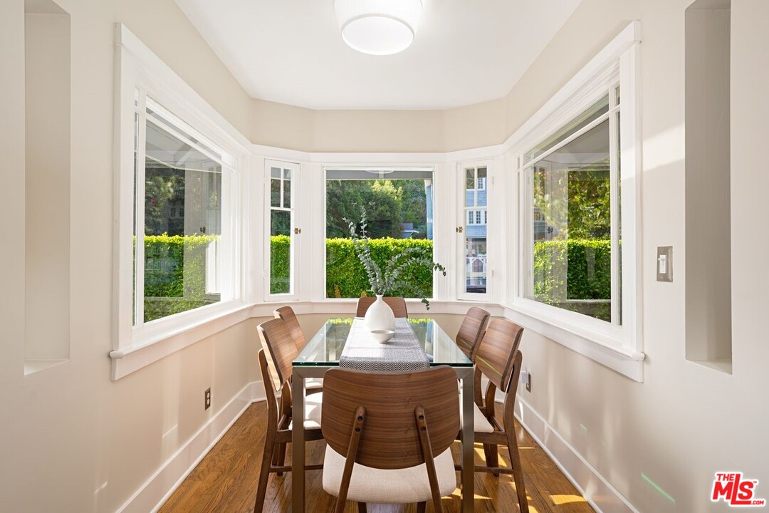 216 West Channel Road Santa Monica, CA 90402 - Photo 11 of 37 a view of a dining room with furniture window and outside view
