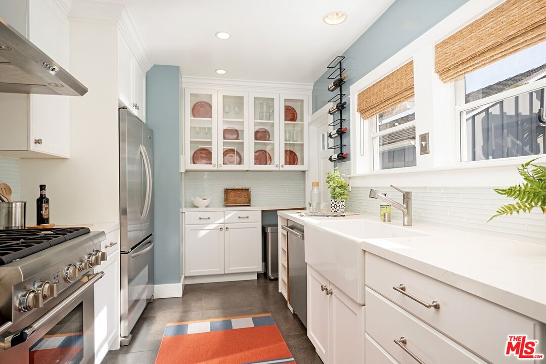 216 West Channel Road Santa Monica, CA 90402 - Photo 13 of 37 a kitchen with a refrigerator stove and sink