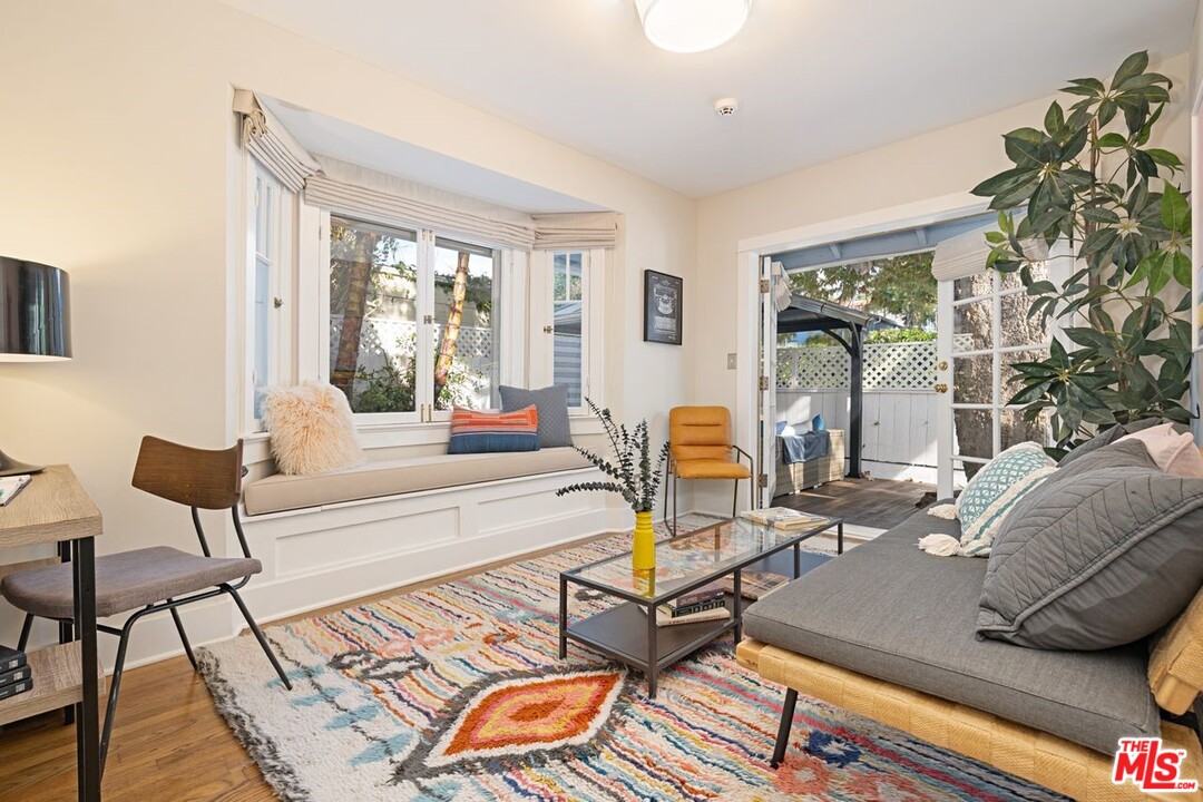 216 West Channel Road Santa Monica, CA 90402 - Photo 20 of 37 a living room with furniture and a large window