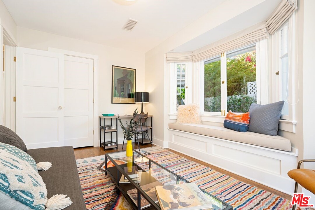 216 West Channel Road Santa Monica, CA 90402 - Photo 21 of 37 a living room with furniture and a table