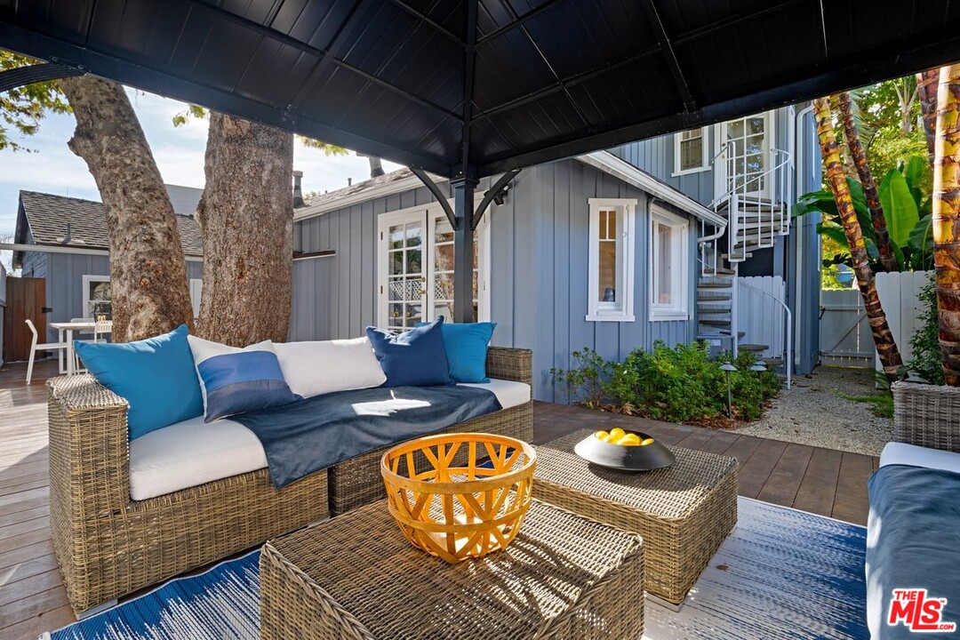 216 West Channel Road Santa Monica, CA 90402 - Photo 24 of 37 a view of a patio in the backyard