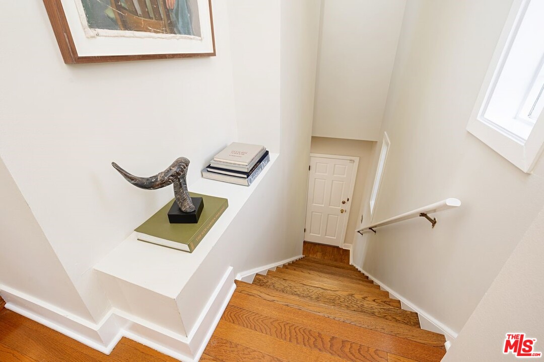 216 West Channel Road Santa Monica, CA 90402 - Photo 27 of 37 a view of walk in closet with clothes and shoes