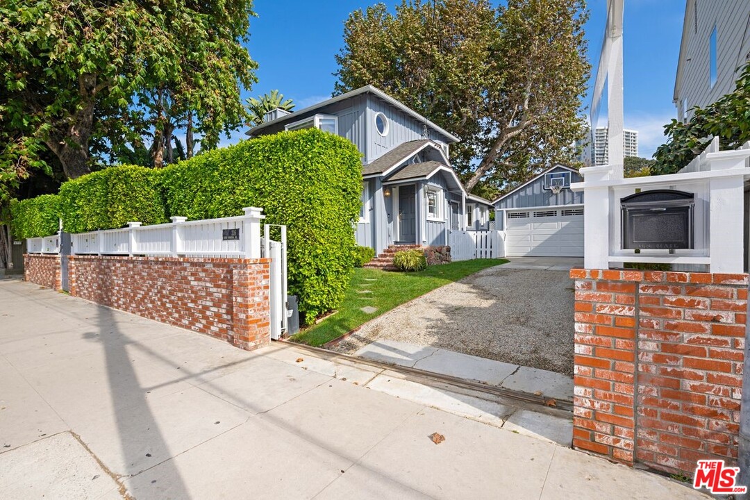 216 West Channel Road Santa Monica, CA 90402 - Photo 4 of 37 a front view of a house with garden