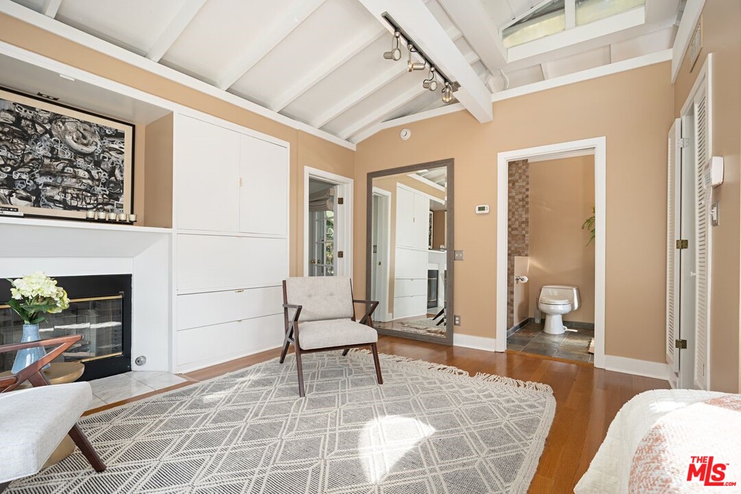 216 West Channel Road Santa Monica, CA 90402 - Photo 33 of 37 a living room with furniture and a fireplace