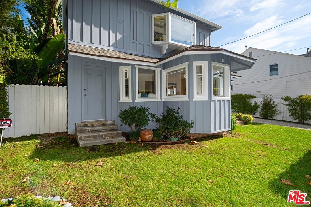 216 West Channel Road Santa Monica, CA 90402 - Photo 6 of 37 a front view of a house with garden