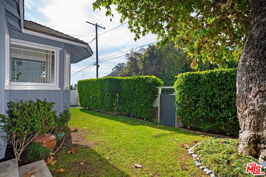 216 West Channel Road Santa Monica, CA 90402 - Photo 7 of 37 a view of a back yard of the house