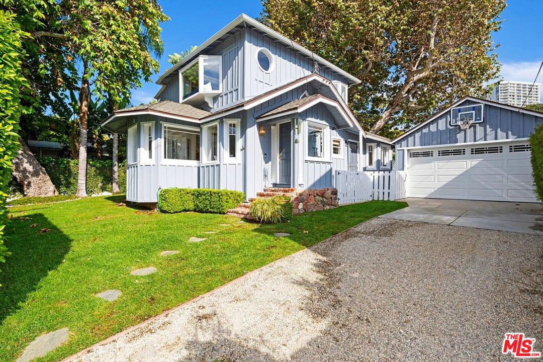 216 West Channel Road Santa Monica, CA 90402 - Photo 8 of 37 a front view of a house with a yard and porch