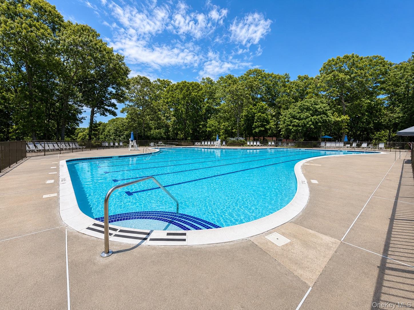 201 Birchwood Road, Unit 201 Coram, NY 11727 - Photo 21 of 27 a view of a swimming pool with a yard and sitting area