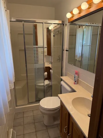 a view of an empty room with windows