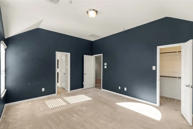 a bathroom with a granite countertop sink a mirror and a bathtub