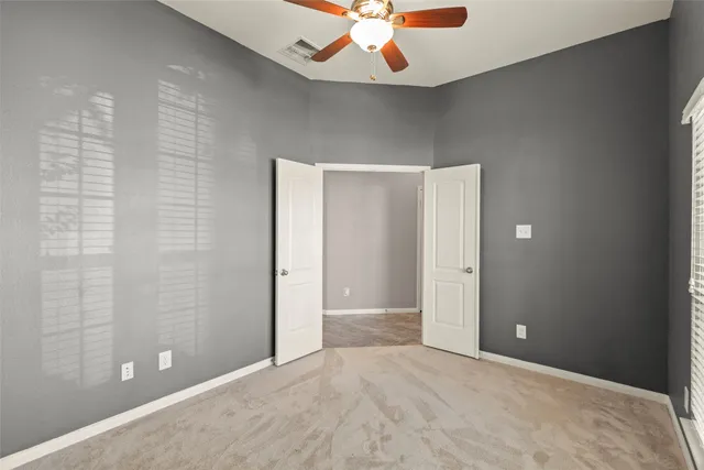a view of an empty room with a bathroom