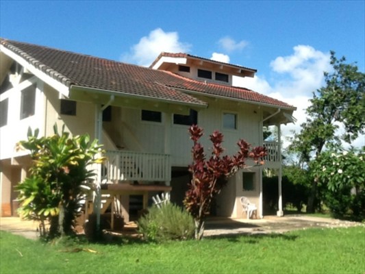 4085 Noho Road Koloa, HI 96756 - Photo 1 of 4 a front view of a house with a garden