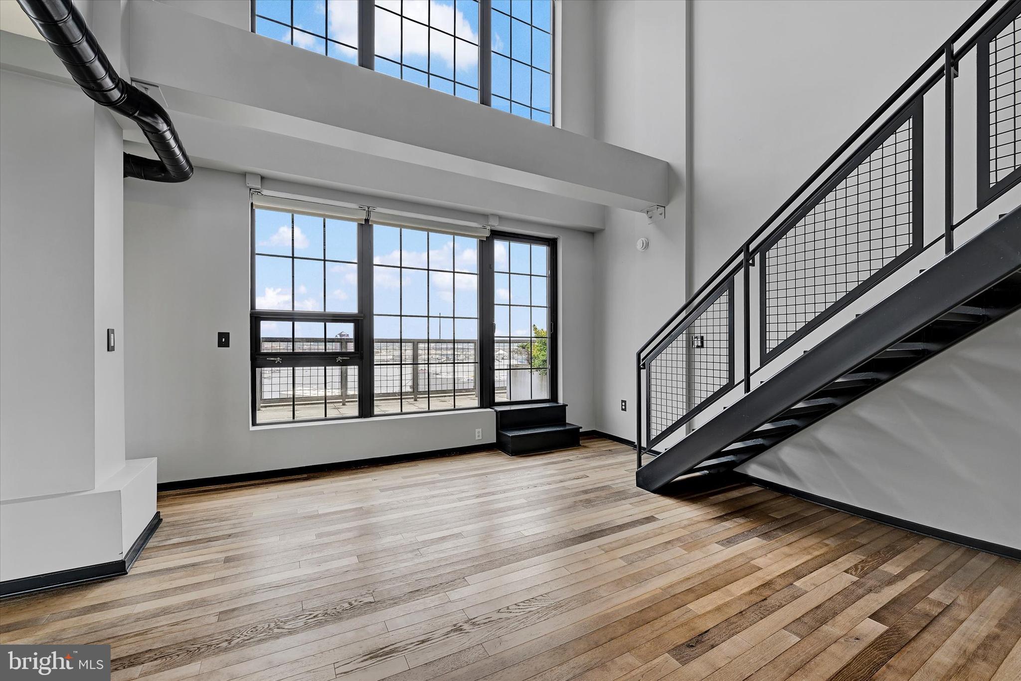 1200 Steuart Street, Unit 1913 Baltimore, MD 21230 - Photo 19 of 94 Soaring two-story Dining room.